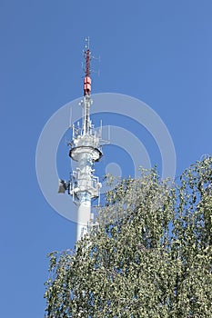 Vertical shot of the Radio broadcasting mast against the blue sky