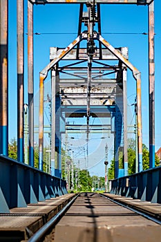 Vertical shot of a railway bridge in Emden ar the daytime photo