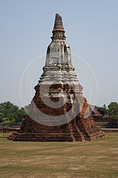 Vertical shot of the red brick Wat Chai Watthanaram temple in Ayutthaya, Thailand