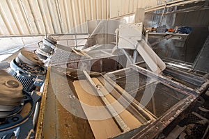 Vertical shot of a reparation process in an Industrial workshop with equipment