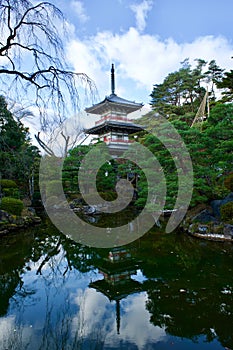 Vertical shot of Rinno-Ji Temple among the trees in Sendai, Japan