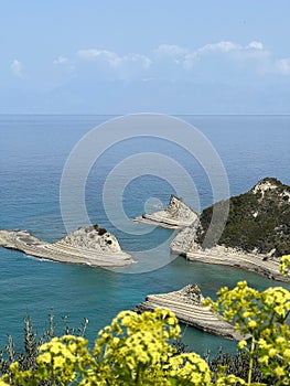 Vertical shot of the rocks that have been eroded by the water at cape Drastis beach