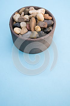 Vertical shot of rocks and pebble in a bowl