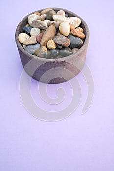 Vertical shot of rocks and pebble in a bowl