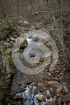 Vertical shot of a rocky Francia river in the Batuecas Natural Park, Spain photo