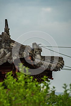 Vertical shot of a roof of an old Asian-style pavilion in Qinglonghu park, Chengdu, China