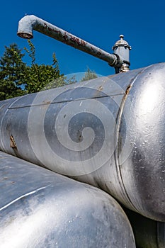 Vertical shot of rusty metal cisterns