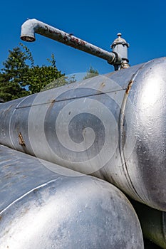 Vertical shot of rusty metal cisterns