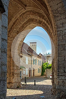 Vertical shot of the Saint Maur church in Martel, Lot, France during d