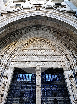 Vertical shot of Santa Iglesia Catedral Primada de Toledo entrance in Toledo, Spain photo