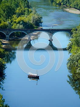 Vertical shot of a scow in Dordogne river, France at daytime