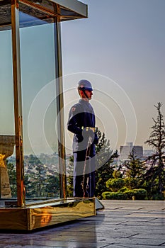 Vertical shot of a security guard on duty in front of the Anitkabir museum in Turkey
