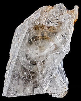 Vertical shot of the Selenite mineral isolated on black background
