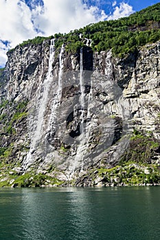 Vertical shot of The Seven Sisters waterfall in Geiranger Fjord Sunnmore More og Romsdal Norway