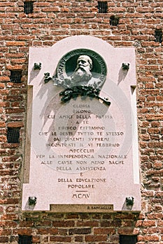 Vertical shot of the Sforza's Castle plaque,to commemorate Giuseppe Piolti de Bianchi in Milan,Italy photo