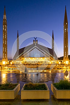 Vertical shot of the Shah Faisal Masjid Mosque in Islamabad, Pakistan at sunset photo