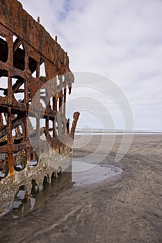 Vertical shot of the shipwreck in Fort Stevens State Park, Oregon