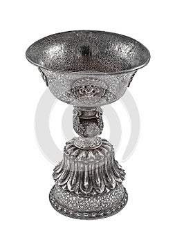 Vertical shot of a silver vintage goblet under the lights isolated on a white background