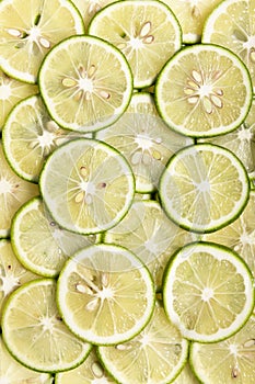 Vertical shot of slices of fresh lime