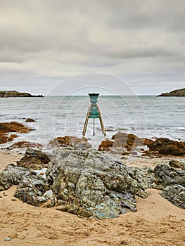 Vertical shot of St Patrick's Tide and Time Bell at Cemaes Bay