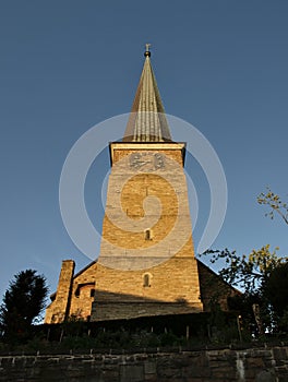 Vertical shot of St. Peter`s Church in Mulheim Ruhr in warm evening sunlight