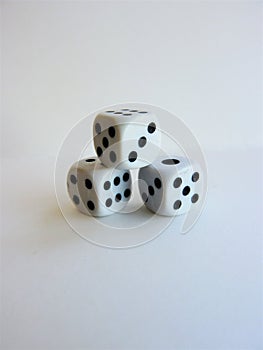 Vertical shot of a stack of dice isolated on a white background