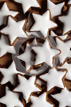 Vertical shot of star-shaped German cinnamon cookies called Zimtstern