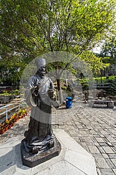 Vertical shot of the statue of Padre Matteo Ricci, an Italian priest in China, Macau photo