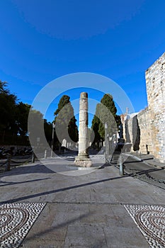 Vertical shot of a stone column in the Via del Imperio de Roma in Tarragona, Catalonia, Spain photo