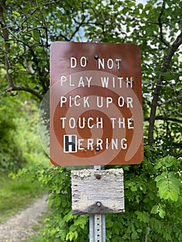 Vertical shot of a street sign found in the town of Brewster photo