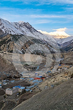 Vertical shot of the sunrise over mountain village in Manang District, Annapurna circuit trek, Nepal