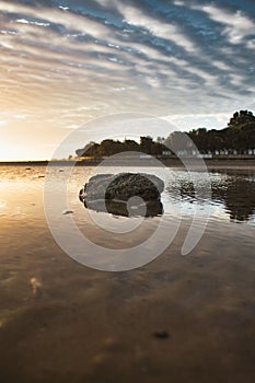 Vertical shot of a sunset over Appley beach in Ryde, Isle of Wight, England.