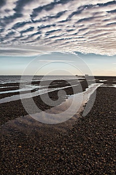 Vertical shot of a sunset over Appley beach in Ryde, Isle of Wight, England.