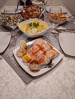 Vertical shot of a table full of food and tableware