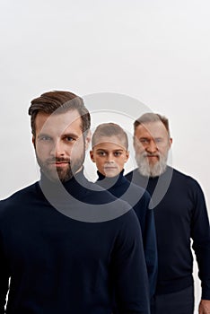 Vertical shot of three generations of men together