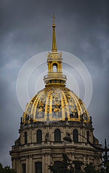 Vertical shot of Tomb of Napoleon Bonaparte under a cloudy sky on a rainy day in Paris, France