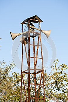 Vertical shot of tower of electric sirens for warning the population