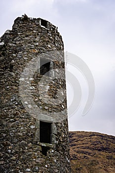 Vertical shot of the tower of the Kilchurn Castle at the northeastern end of Loch Awe in Scotland