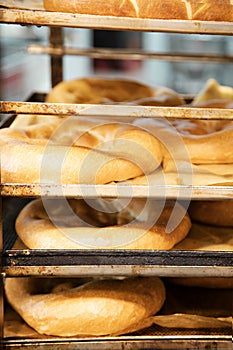 Vertical shot of transporting trays rack with fresh bakery