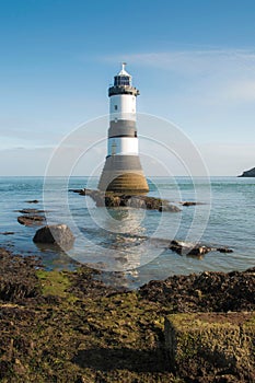 Vertical shot of the Trwyn Du Lighthouse in Wales, UK