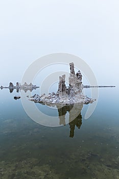 Vertical shot of tufa formation and its reflection on Mono Lake in California