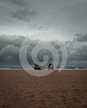 Vertical shot of two cars on Gold Coast's beaches, Australia.