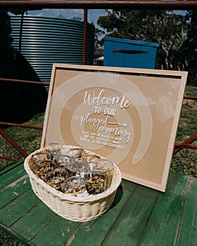 Vertical shot of an unplugged ceremony sign encouraging people to turn off phones at a wedding