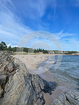 Vertical shot of the Uto island in the southern archipelago of Stockholm against a blue sky photo