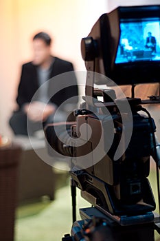 Vertical shot of a video camera viewfinder, recording show in a TV studio