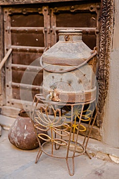 Vertical shot of a vintage milk urn