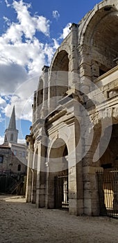 Vertical shot of the wall of Arles Amphitheatre. Roman arena in Arles, France.