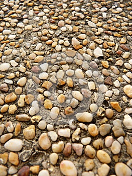 Vertical shot of a wall with pebble stones