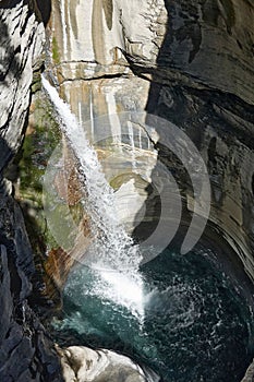 Vertical shot of a waterfall in Leukerbad