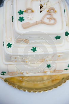 Vertical shot of a wedding cake in a form of suitcase